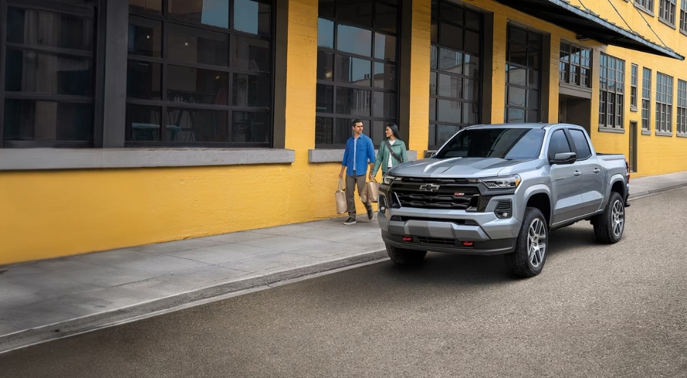 Silver 2024 Chevy Colorado Z71 parked in front of a building