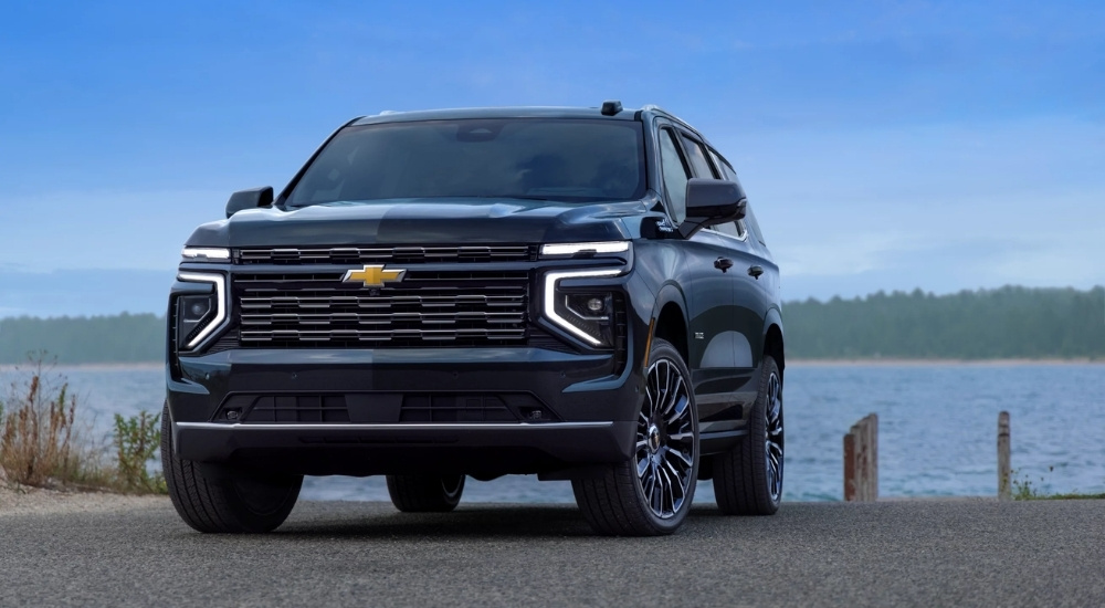 Black 2025 Chevy Tahoe for sale parked near a lake