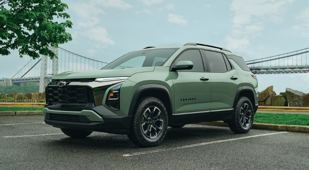 Green 2026 Chevy Equinox parked near a bridge
