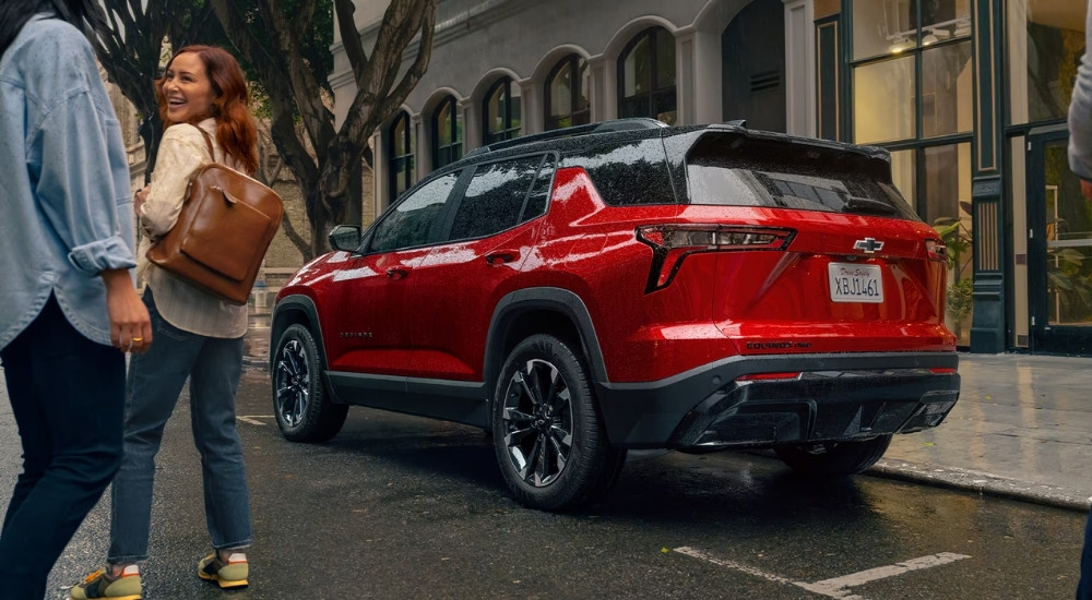 Red 2025 Chevy Equinox RS parked in a city