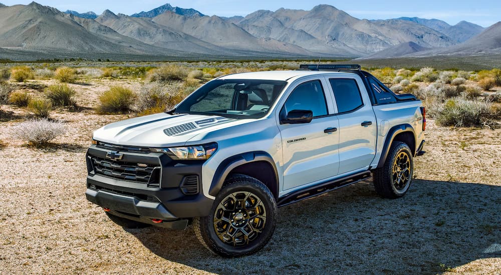 White 2026 Chevy Colorado driving off-road.