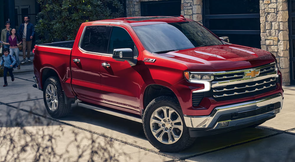 Red 2026 Chevy Silverado 1500 parked on a driveway.