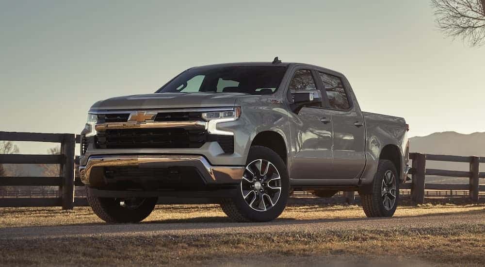 A silver 2026 Chevy Silverado 1500 parked off-road.