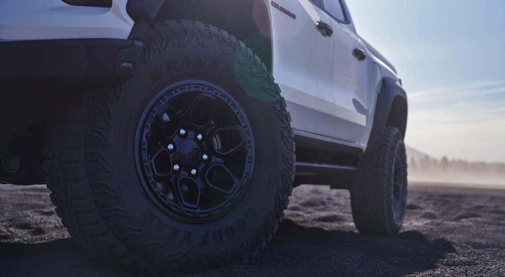 Low angle close-up on the wheels of a white 2024 Chevy Colorado ZR2 Bison