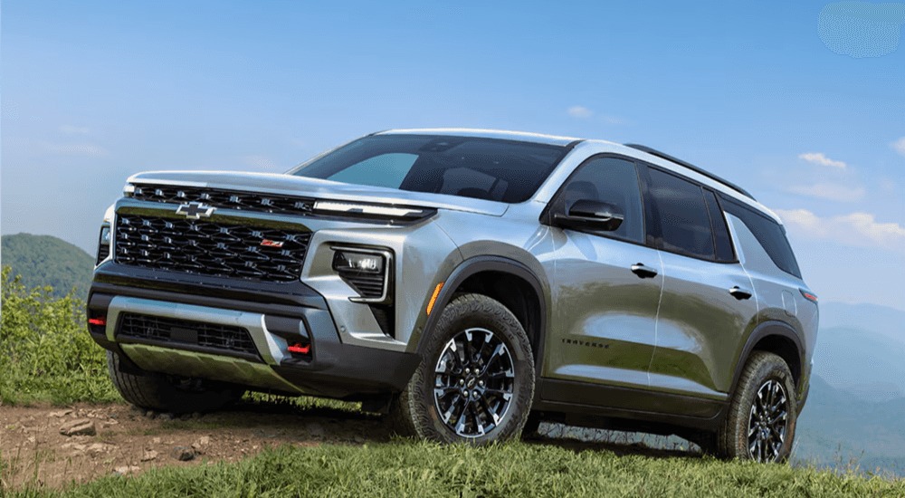 Silver 2026 Chevy Traverse parked on a hill
