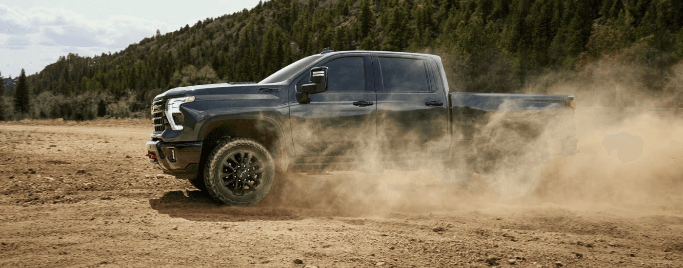 Black 2026 Chevy Silverado 2500 HD ZR2 drifting off-road