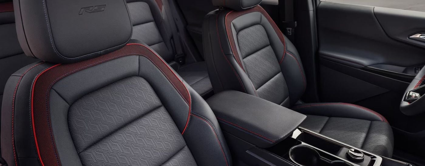 Black leather interior with red stitching in a 2026 Chevy Equinox RS