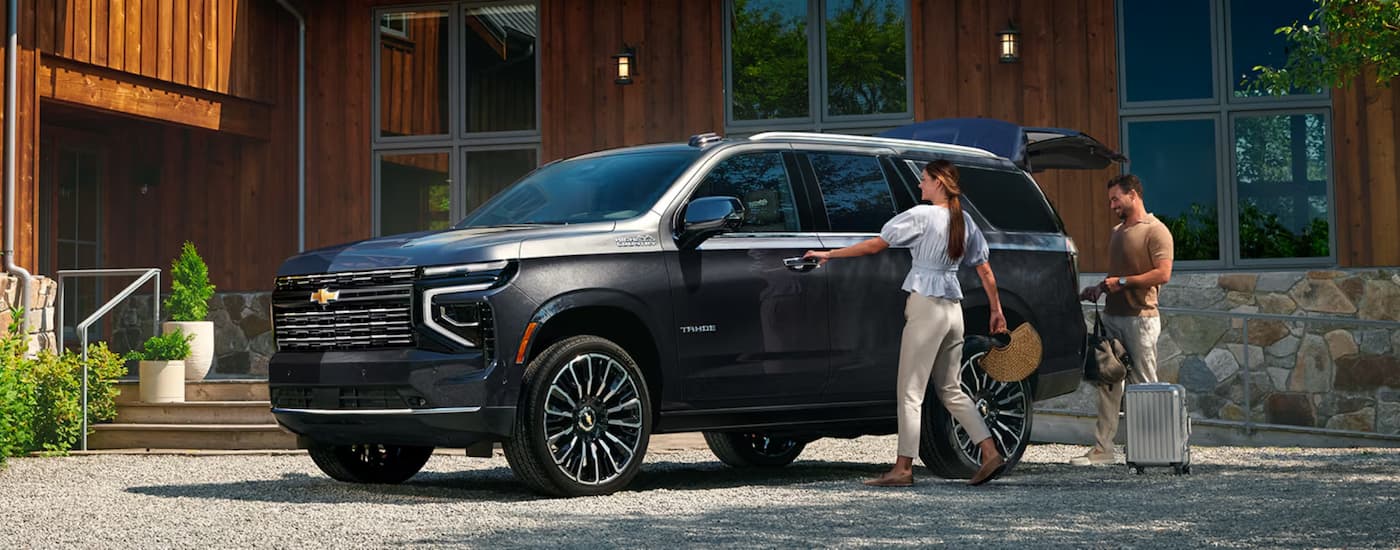 Black 2026 Chevy Tahoe High Country parked on a driveway.