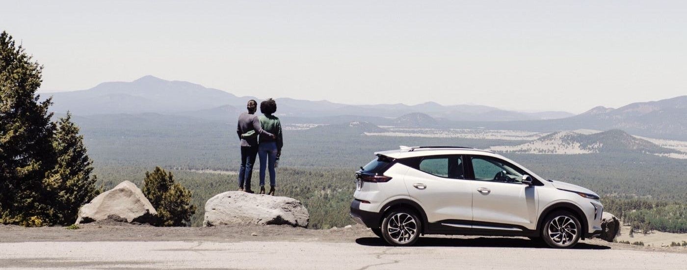 White 2023 Chevy Bolt EUV overlooking distant mountains