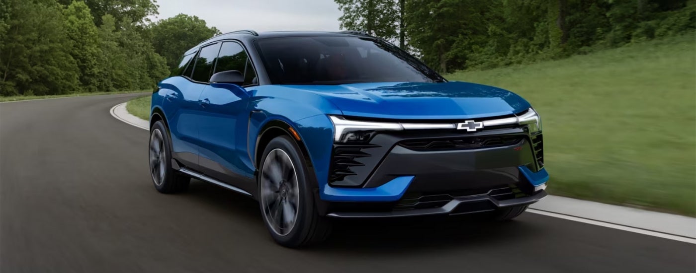Blue 2025 Chevy Blazer EV rounding a corner