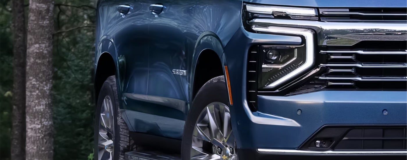 Passenger side headlight on a blue 2025 Chevy Suburban