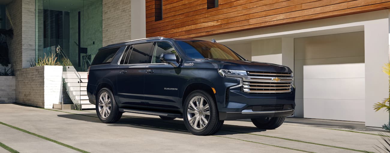 Blue 2021 Chevy Suburban High Country parked on a driveway