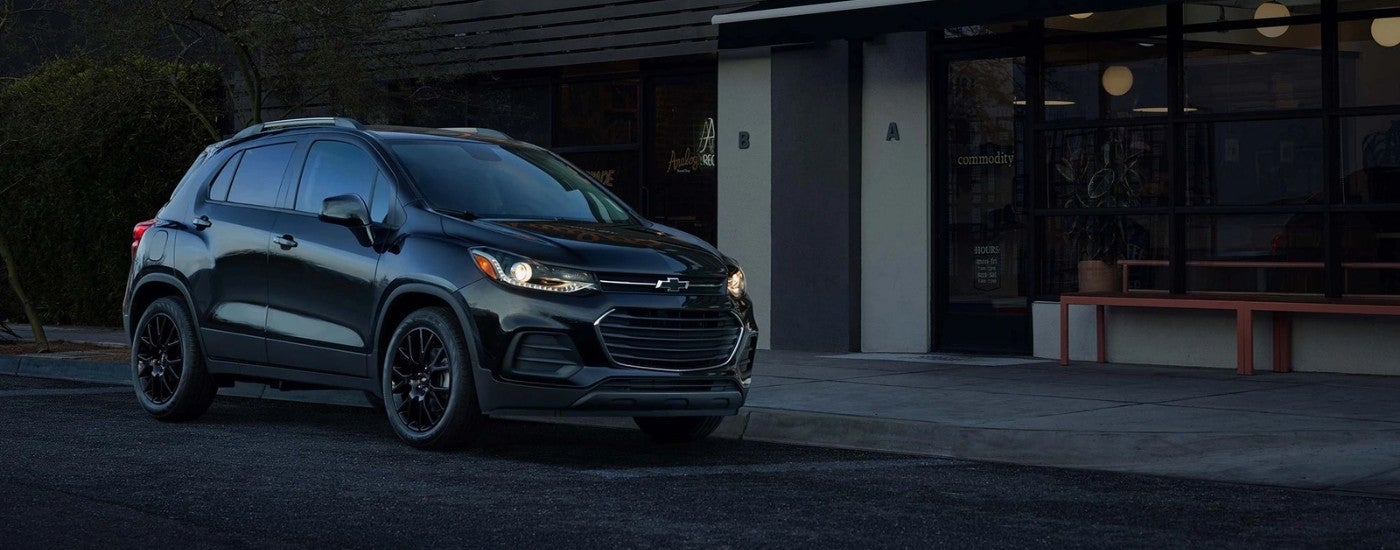 Black 2022 Chevy Trax parked near a Chevrolet dealer