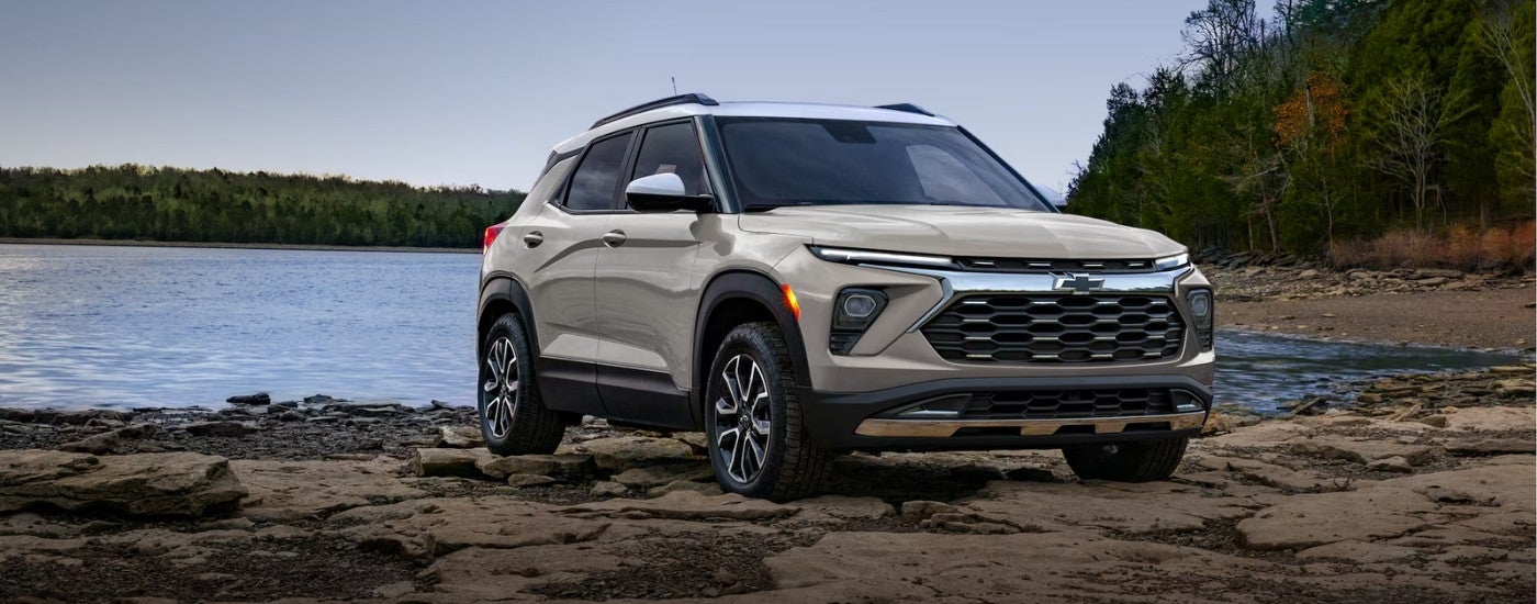 Tan 2026 Chevy Trailblazer parked on a lakeshore