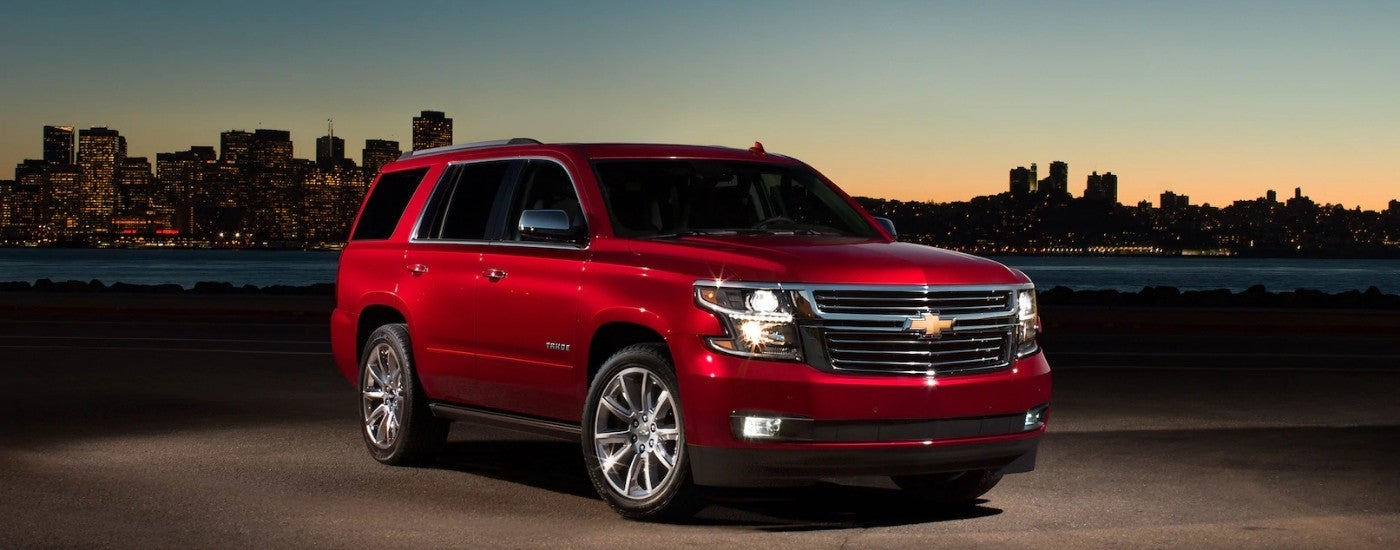 Red 2017 Chevy Tahoe parked overlooking a city