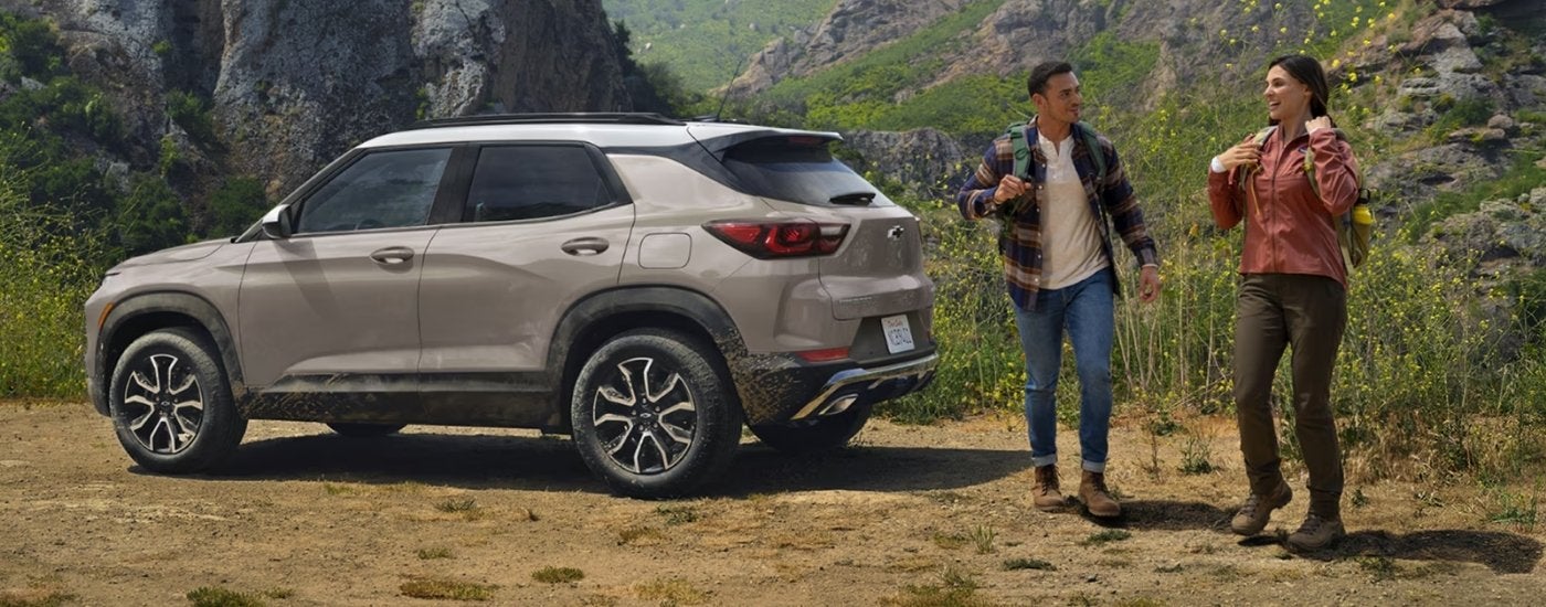 Tan 2026 Chevy Trailblazer parked near hikers
