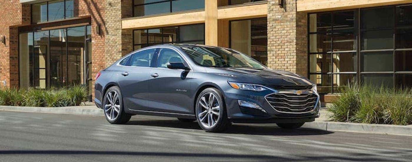 A grey 2019 Chevy Malibu is shown from the front at an angle.