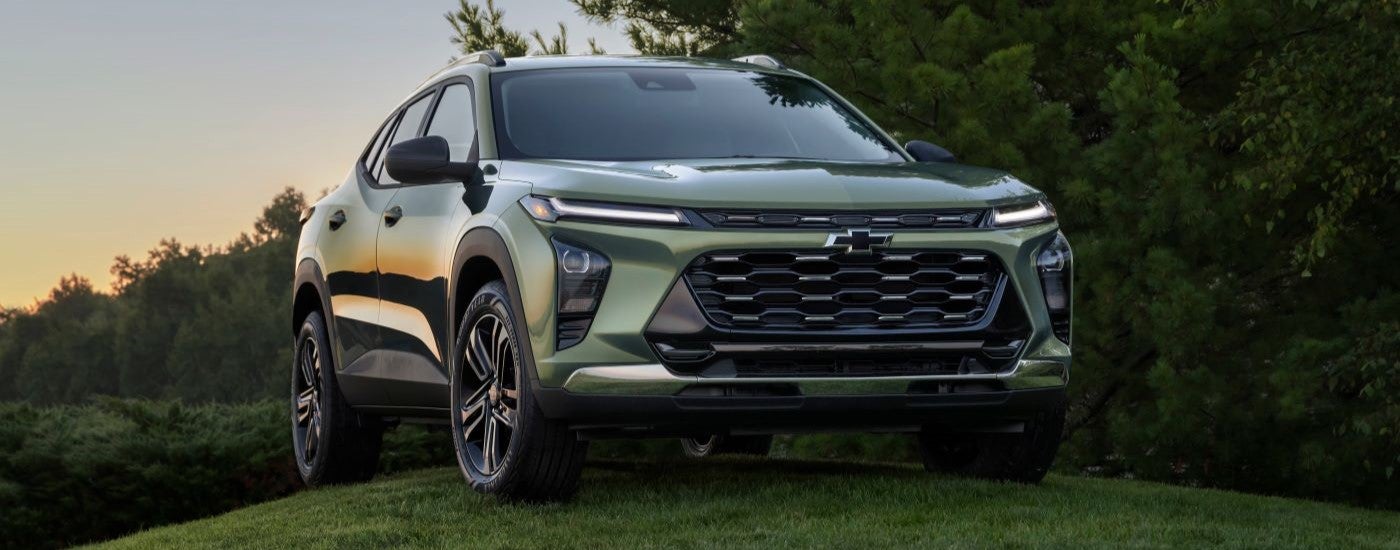 Green 2024 Chevy Trax parked on a grassy field