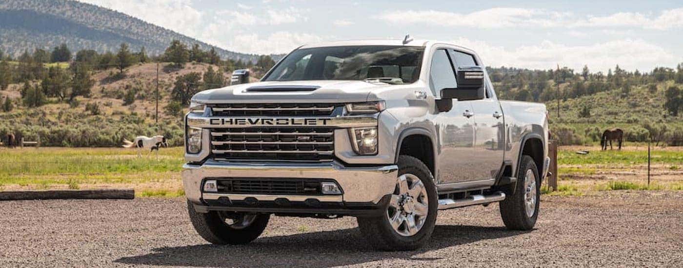 A silver 2022 Chevy Silverado 2500 HD is shown from the front at an angle.